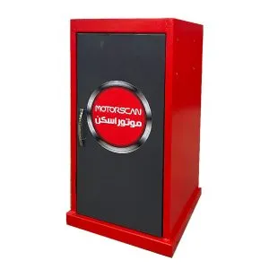 A red and black rectangular box with a door. The door has a circular logo with the text 'MOTORSCAN' and some Arabic text. This image appears to depict a piece of equipment, possibly related to automotive diagnostics or scanning.