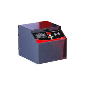 A black control panel with a slanted front panel featuring a digital display and multiple buttons. The display provides operational data, while the buttons allow users to interact with the system. The device is encased in a sturdy dark-colored housing with visible screws on the sides, suggesting a secure build for industrial or technical use