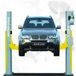 A two-post car lift labeled 'MOTOR SCAN' and 'L 235 A,' lifting a BMW SUV off the ground. The yellow arms of the lift securely hold the vehicle in place, allowing easy access to the underside for maintenance and repair work. This type of equipment is commonly used in automotive repair shop