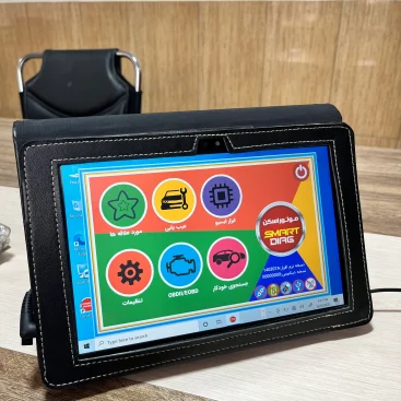 interface with six circular icons labeled in Persian. The icons represent various functionalities related to vehicle diagnostics, including Smart Diag Modulation, Scanner Tool, Troubleshooting, OBDII/OBD Vehicle Search, Favorites, and Settings. In the background, a black chair is partially visible